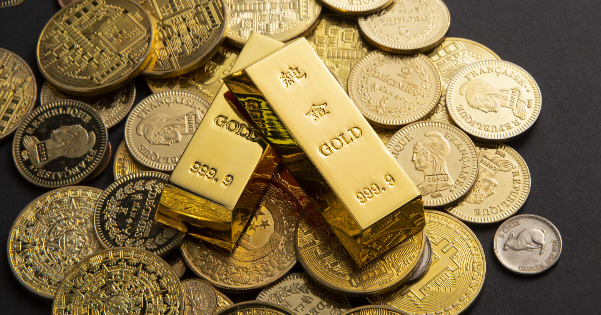 barras e moedas de ouro